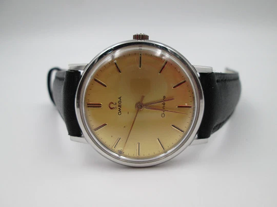 Omega Genève. Stainless steel. Circa 1960's. Manual wind. Black strap