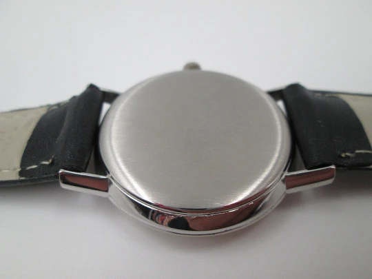 Omega Genève. Stainless steel. Circa 1960's. Manual wind. Black strap