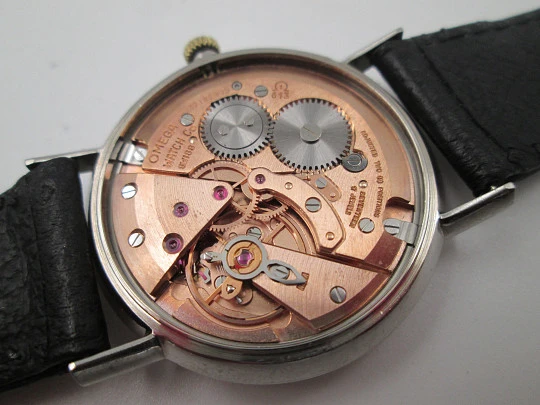 Omega Genève. Stainless steel. Manual wind. Calendar. Leather strap. Swiss. 1960's
