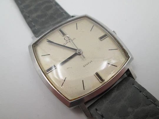 Omega Genève. Stainless steel. Manual wind. Grey dial. TV format. Leather strap. 1960's