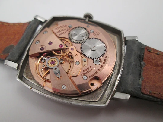 Omega Genève. Stainless steel. Manual wind. Grey dial. TV format. Leather strap. 1960's