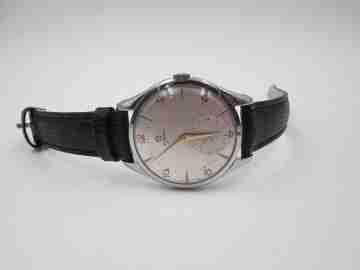Omega Jumbo. Cuerda manual. Acero inoxidable. Correa. Años 50. Suiza