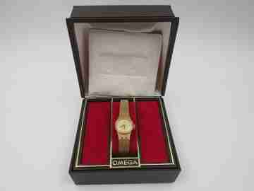Omega mujer. Chapado oro y acero. Cuerda manual. Brazalete. Estuche. 1970