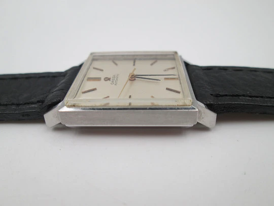 Omega unisex automatic wristwatch. Stainless steel. Square case. Grey dial. Swiss. 1960's Omega unisex automatic wristwatch. Stainless steel. Square case. Grey dial. Swiss. 1960's