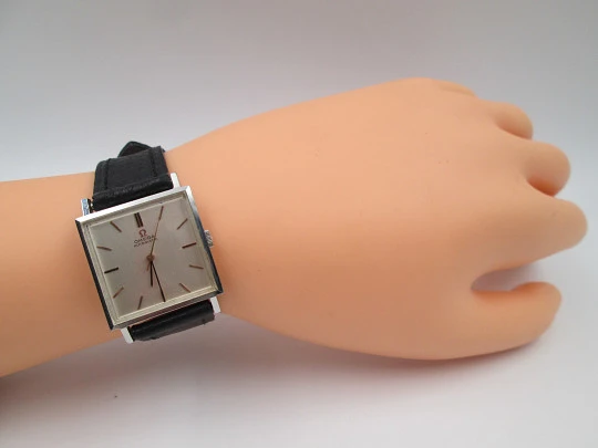 Omega unisex automatic wristwatch. Stainless steel. Square case. Grey dial. Swiss. 1960's Omega unisex automatic wristwatch. Stainless steel. Square case. Grey dial. Swiss. 1960's