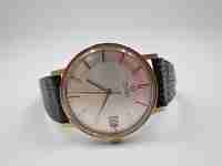Omega. Chapado oro / acero. Automático. Calendario. Correa. 1960