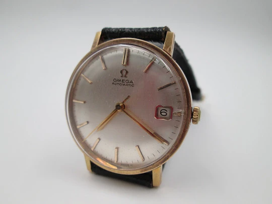 Omega. Chapado oro / acero. Automático. Calendario. Correa. 1960