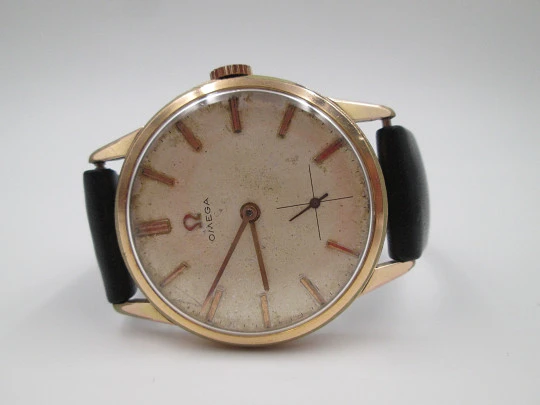 Omega. Gold plated & stainless steel. 1960's. Manual wind. Strap. Sub second