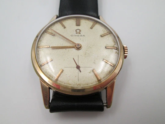Omega. Gold plated & stainless steel. 1960's. Manual wind. Strap. Sub second