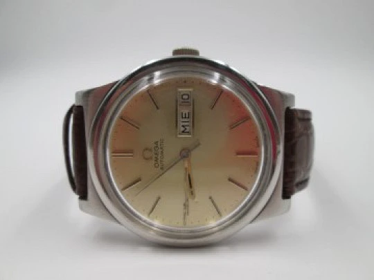 Omega. Stainless steel. Automatic. 1970's. Golden dial. Date & day