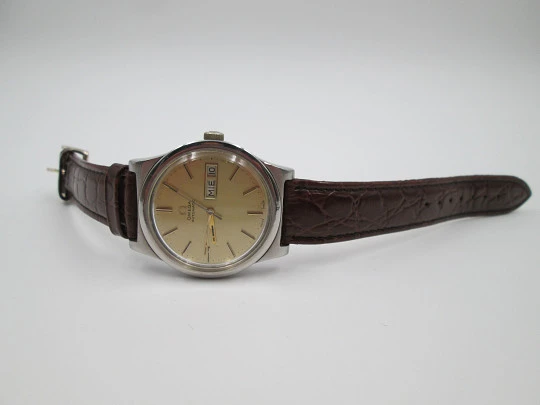 Omega. Stainless steel. Automatic. 1970's. Golden dial. Date & day