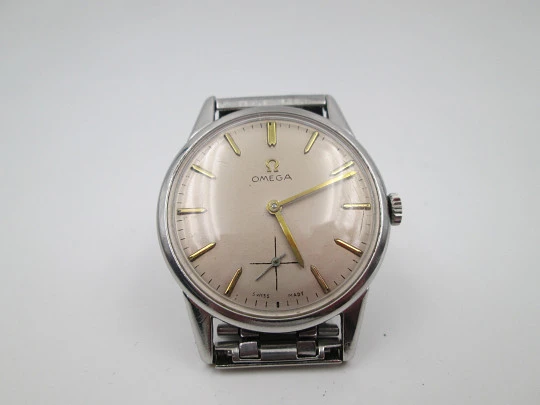 Omega. Stainless steel. Manual wind. Small seconds hand. Bracelet. 1960's. Swiss