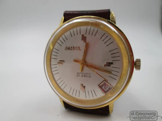Omodox. Gold plated and steel. Automatic. Date. 1960's. Swiss