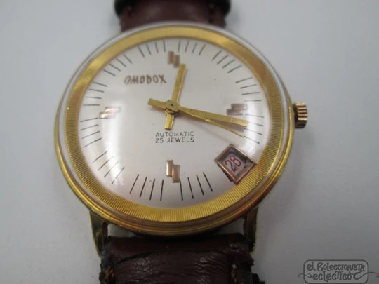 Omodox. Gold plated and steel. Automatic. Date. 1960's. Swiss