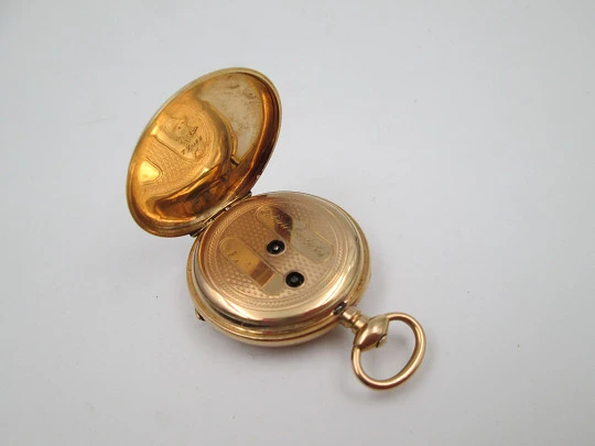 Open-face pocket watch. 14 karat yellow gold. Key-wind movement. Floral motifs. 1890's