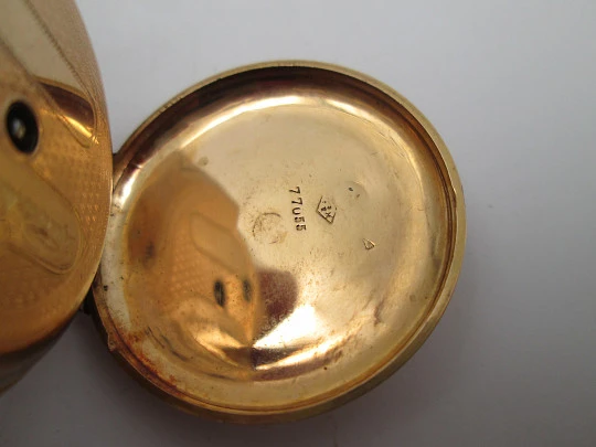 Open-face pocket watch. 14 karat yellow gold. Key-wind movement. Floral motifs. 1890's