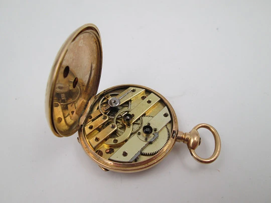 Open-face pocket watch. 14 karat yellow gold. Key-wind movement. Floral motifs. 1890's