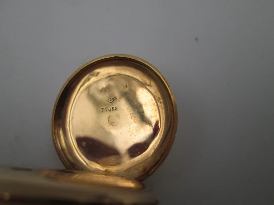 Open-face pocket watch. 14 karat yellow gold. Key-wind movement. Floral motifs. 1890's