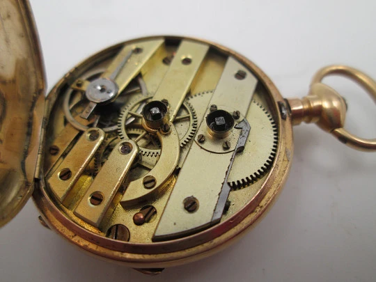 Open-face pocket watch. 14 karat yellow gold. Key-wind movement. Floral motifs. 1890's