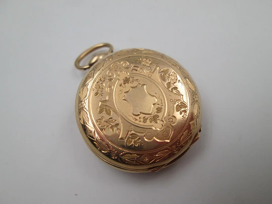 Open-face pocket watch. 14 karat yellow gold. Key-wind movement. Floral motifs. 1890's