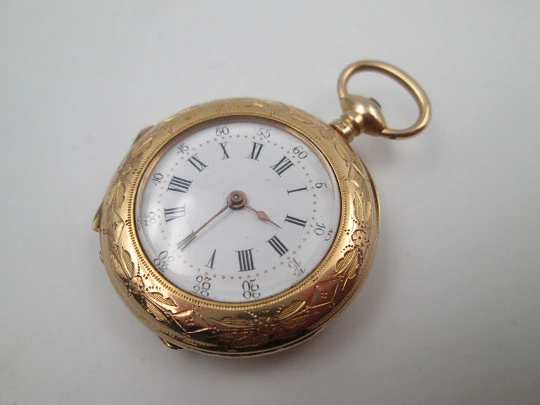 Open-face pocket watch. 14 karat yellow gold. Key-wind movement. Floral motifs. 1890's