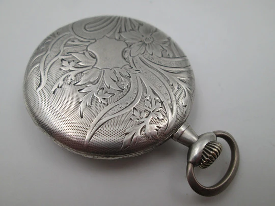 Open face pocket watch. 800 sterling silver. Ornate back. Small second hand