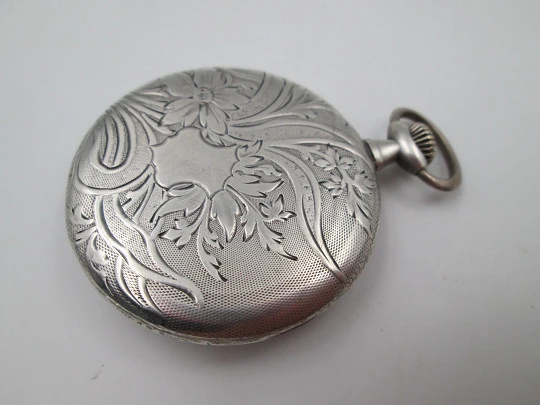 Open face pocket watch. 800 sterling silver. Ornate back. Small second hand