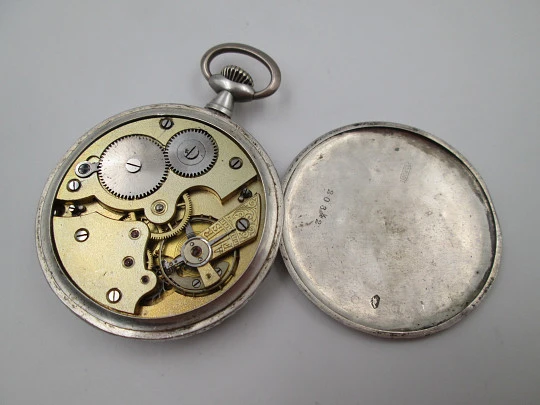 Open face pocket watch. 800 sterling silver. Ornate back. Small second hand