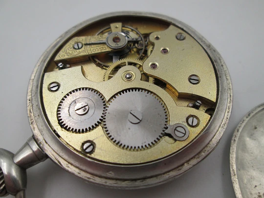 Open face pocket watch. 800 sterling silver. Ornate back. Small second hand