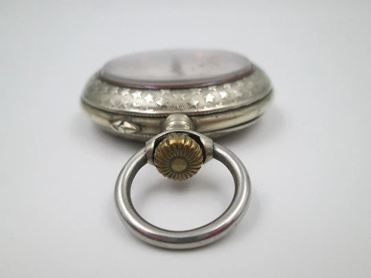 Open-face pocket watch. Nickel plated metal. Stars pattern. Stem-wind. Bitone dial. 1920's Open-face pocket watch. Nickel plated metal. Stars pattern. Stem-wind. Bitone dial. 1920's