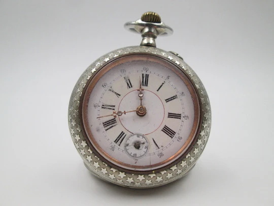 Open-face pocket watch. Nickel plated metal. Stars pattern. Stem-wind. Bitone dial. 1920's Open-face pocket watch. Nickel plated metal. Stars pattern. Stem-wind. Bitone dial. 1920's