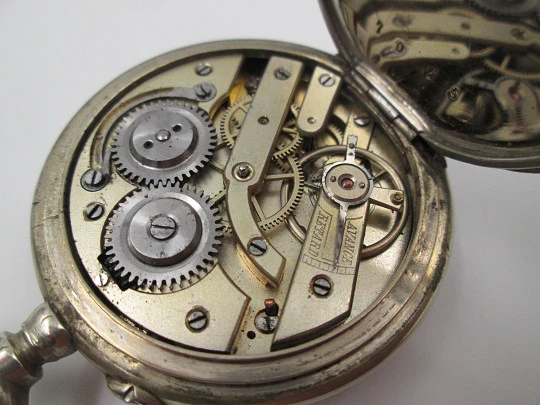 Open-face pocket watch. Nickel plated metal. Stars pattern. Stem-wind. Bitone dial. 1920's Open-face pocket watch. Nickel plated metal. Stars pattern. Stem-wind. Bitone dial. 1920's