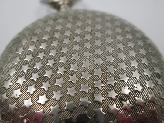 Open-face pocket watch. Nickel plated metal. Stars pattern. Stem-wind. Bitone dial. 1920's Open-face pocket watch. Nickel plated metal. Stars pattern. Stem-wind. Bitone dial. 1920's