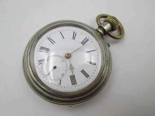 Open face pocket watch. Silver plated. Porcelain dial. Small second hand. 1900's
