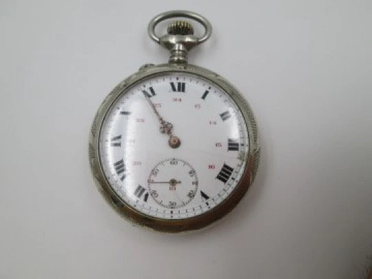 Open face pocket watch. Silver plated. Stem-wind. 1910. France. Ornate back