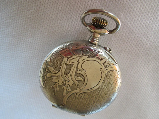 Open face pocket watch. Silver plated. Stem-wind. 1910. France. Ornate back