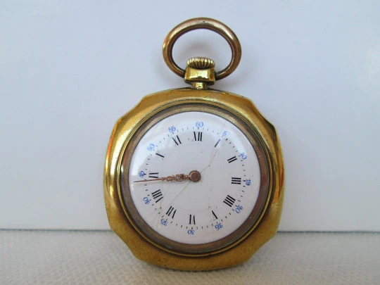 Open-face swiss pocket watch. Octogonal case. Gold plated metal