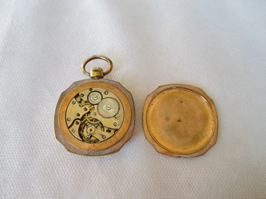 Open-face swiss pocket watch. Octogonal case. Gold plated metal