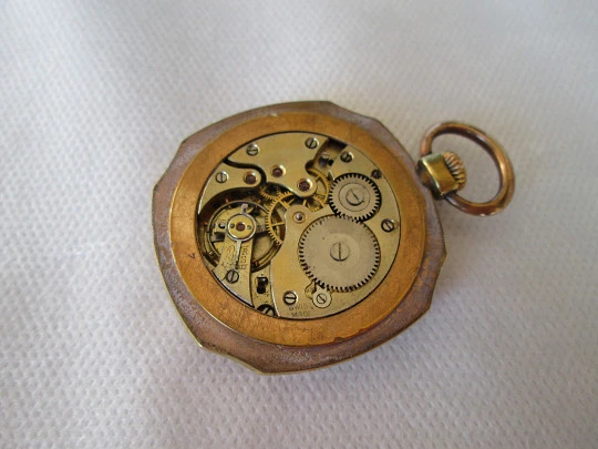 Open-face swiss pocket watch. Octogonal case. Gold plated metal