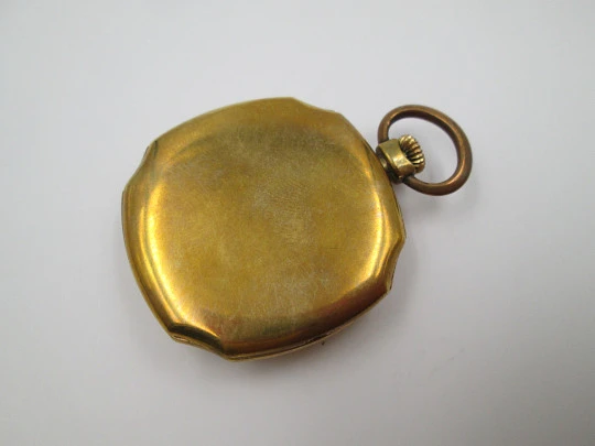 Open-face swiss pocket watch. Octogonal case. Gold plated metal