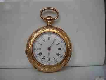 Open-face. 14 karat gold. 19th century. Key-wind. Floral motifs