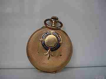 Open-faced. 14 karat gold. 1920's. Blue enamel. Stem-wind. Swiss