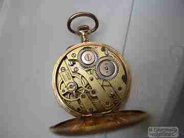 Open-faced. 14 karat gold. 1920's. Blue enamel. Stem-wind. Swiss