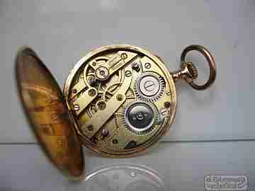 Open-faced. 14 karat gold. 1920's. Blue enamel. Stem-wind. Swiss