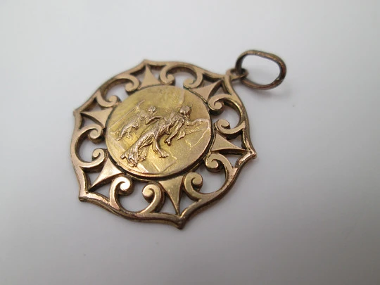 Openwork golden metal medal. Guardian Angel. Scrolls & triangles
