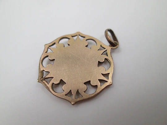 Openwork golden metal medal. Guardian Angel. Scrolls & triangles