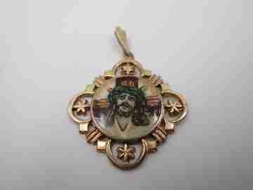 Openwork golden metal medal. Painted scene Jesus crucified. 1940's