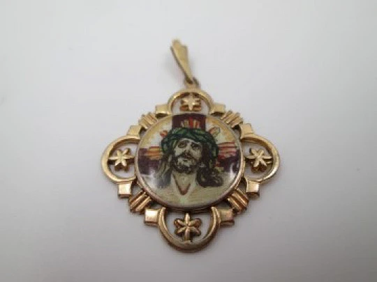 Openwork golden metal medal. Painted scene Jesus crucified. 1940's