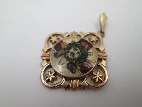 Openwork golden metal medal. Painted scene Jesus crucified. 1940's