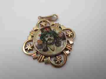 Openwork golden metal medal. Painted scene Jesus crucified. 1940's